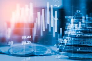 Financing image with Coins and overlapping Statistic Graph