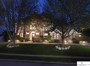 Image of Two Story Home with Lighting at night time